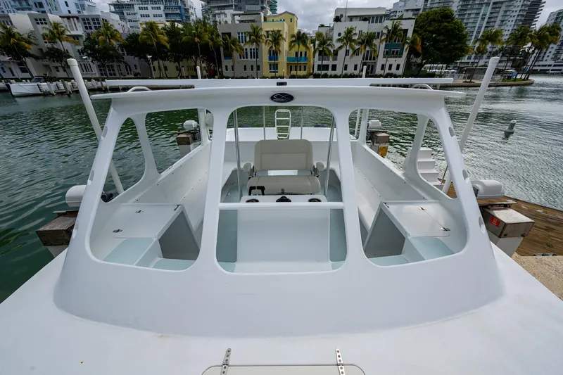 Slide: The Image of 2019 Aventura 31 Catamaran docked in a scenic marina setting. - 13