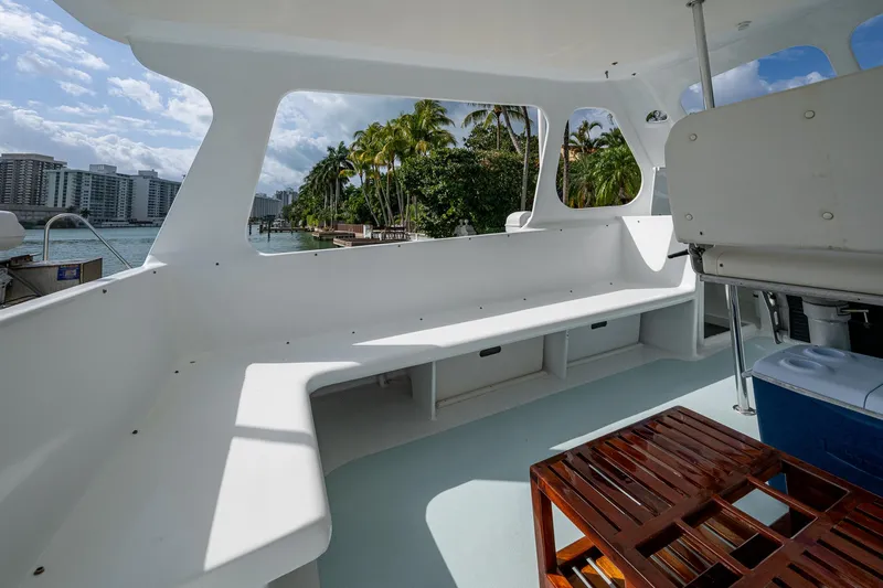 Slide: The Image of 2019 Aventura 31 Catamaran interior with spacious seating and scenic waterfront view. - 2