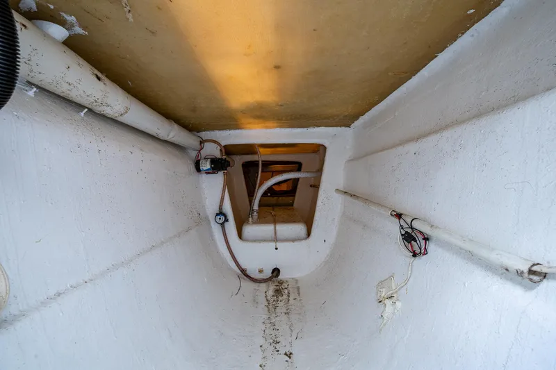 Slide: The Image of Interior view of 2019 Aventura 31 Cat boat, showing pipes and wiring. - 8