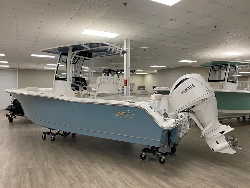 Slide: The Image of 2025 Sea Hunt Ultra 245 SE boat with Yamaha engine in showroom. - 3