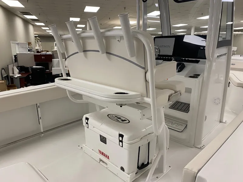 Slide: The Image of 2025 Sea Hunt Ultra 245 SE boat interior with seating and rod holders. - 5