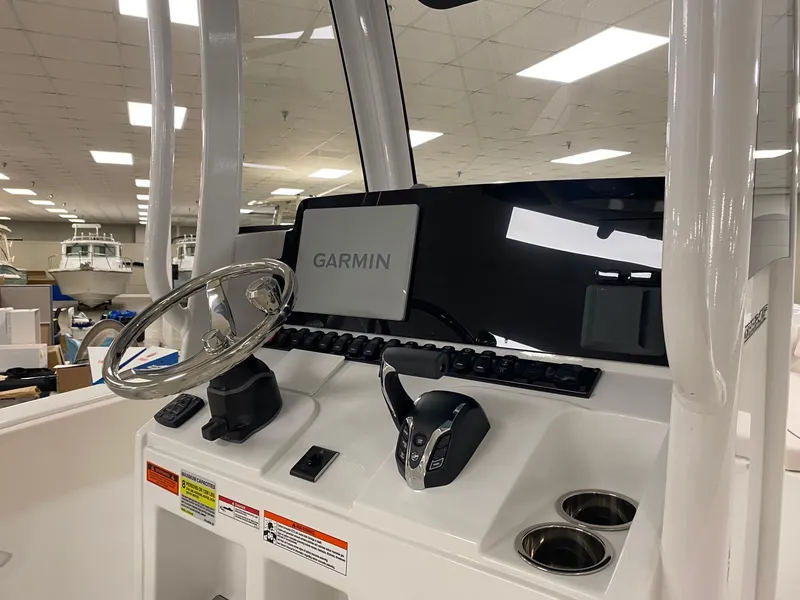 Slide: The Image of 2025 Sea Hunt Ultra 245 SE boat console with Garmin navigation system. - 6