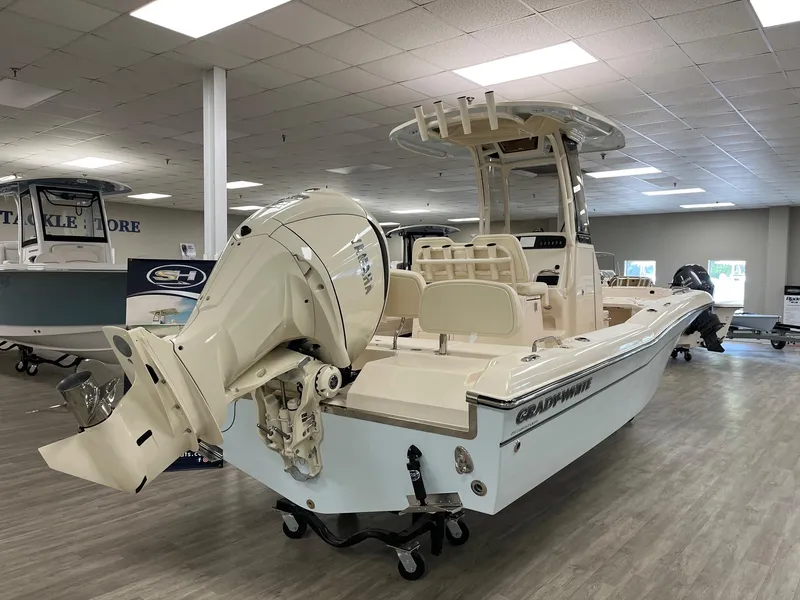 Slide: The Image of 2025 Grady-White Coastal Explorer 251 CE boat in showroom, rear view. - 4