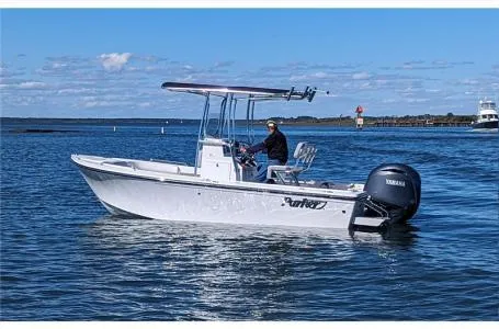 Slide: The Image of 2025 Parker 18SE boat on water with Yamaha outboard motor. - 6