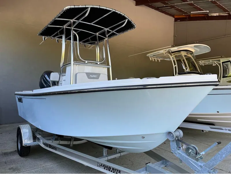 Slide: The Image of 2025 Parker 18SE boat on trailer in storage facility. - 9