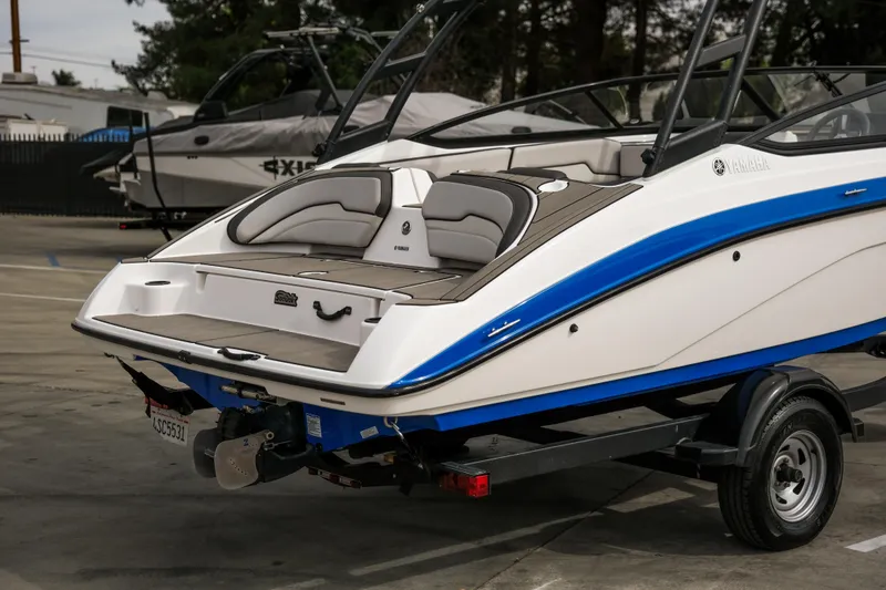 Slide: The Image of 2019 Yamaha Boats AR 190 on trailer, featuring sleek design and blue accents. - 2