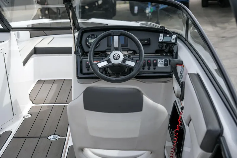Slide: The Image of 2019 Yamaha Boats AR 190 cockpit with steering wheel and dashboard controls. - 3