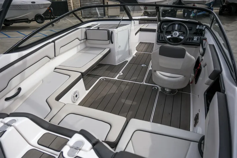 Slide: The Image of 2019 Yamaha Boats AR 190 interior with sleek seating and modern dashboard design. - 5