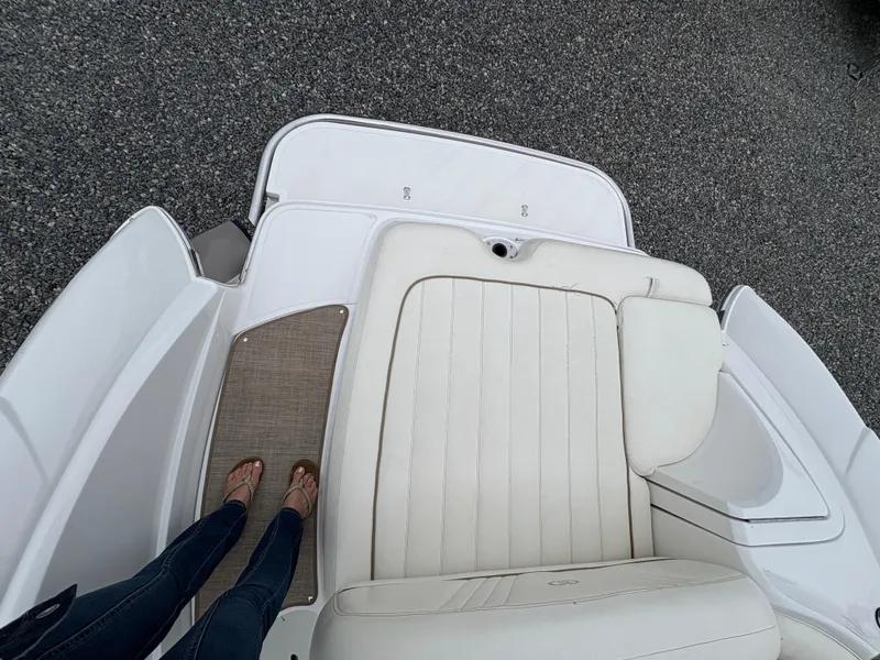 Slide: The Image of 2007 Cobalt 232 Bowrider boat interior with white seating and deck. - 11