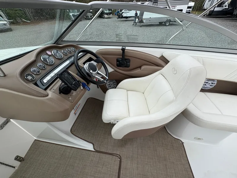 Slide: The Image of 2007 Cobalt 232 Bowrider interior with steering wheel and dashboard controls. - 12