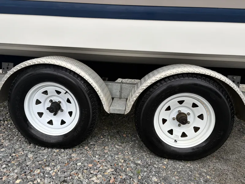 Slide: The Image of Trailer wheels of a 2007 Cobalt 232 Bowrider on gravel surface. - 6