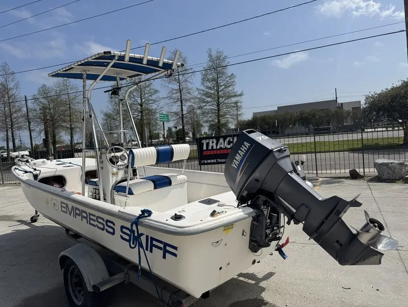 Slide: The Image of 2010 Carolina Skiff DLV 178 boat with Yamaha motor on a trailer. - 6