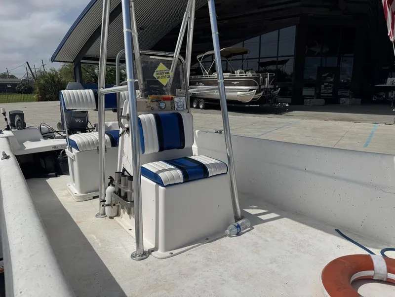 Slide: The Image of 2010 Carolina Skiff DLV 178 boat with striped seating and outdoor storage. - 8