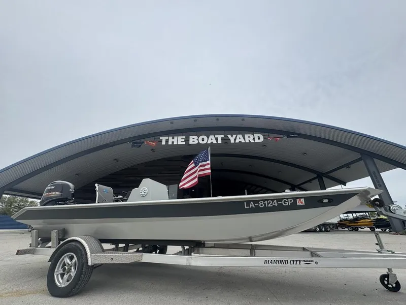 Slide: The Image of Rene Gros Custom 20 boat, 2023 model, on trailer at The Boat Yard with American flag. - 4