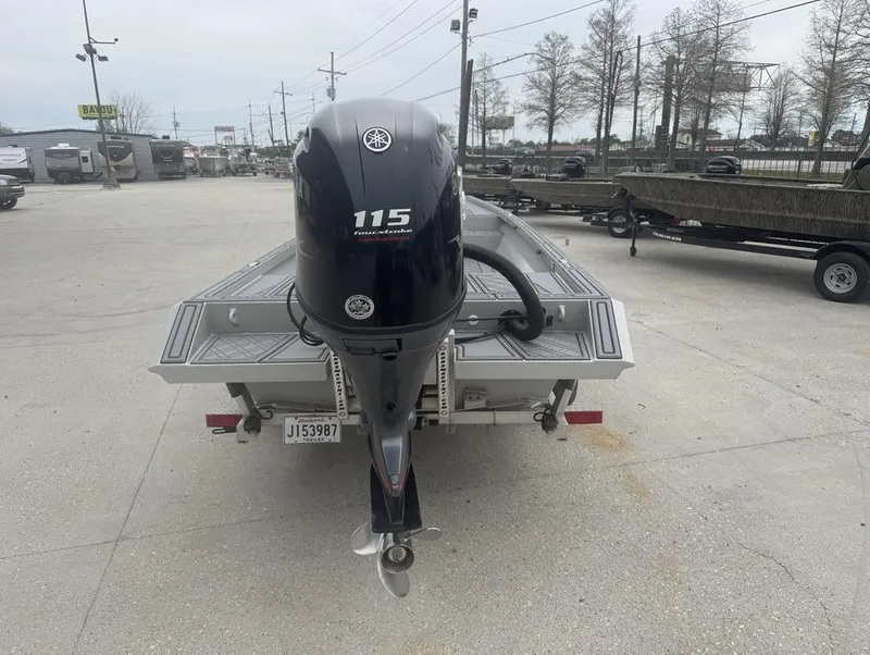 Slide: The Image of Rene Gros Custom 20 boat with Yamaha 115 engine, parked in a dealership lot, 2023 model. - 6