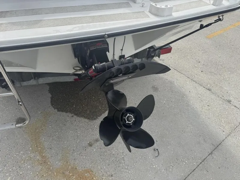 Slide: The Image of Rear view of a 1990 Rinker 206 Captiva Cuddy boat with propeller and outdrive. - 7