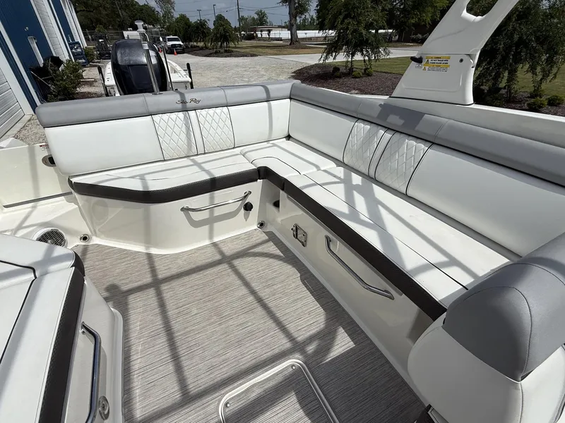 Slide: The Image of 2017 Sea Ray SDX 270 Outboard boat with spacious white seating area. - 10