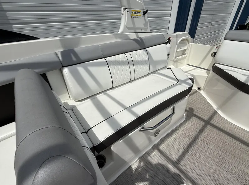 Slide: The Image of 2017 Sea Ray SDX 270 Outboard boat interior with white and gray seating. - 4