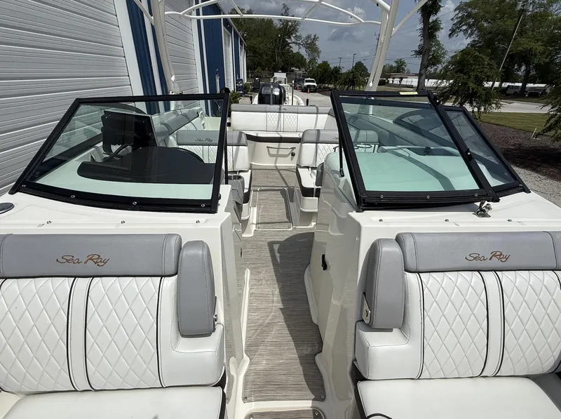 Slide: The Image of 2017 Sea Ray SDX 270 Outboard boat interior with dual windshields and luxurious seating. - 5