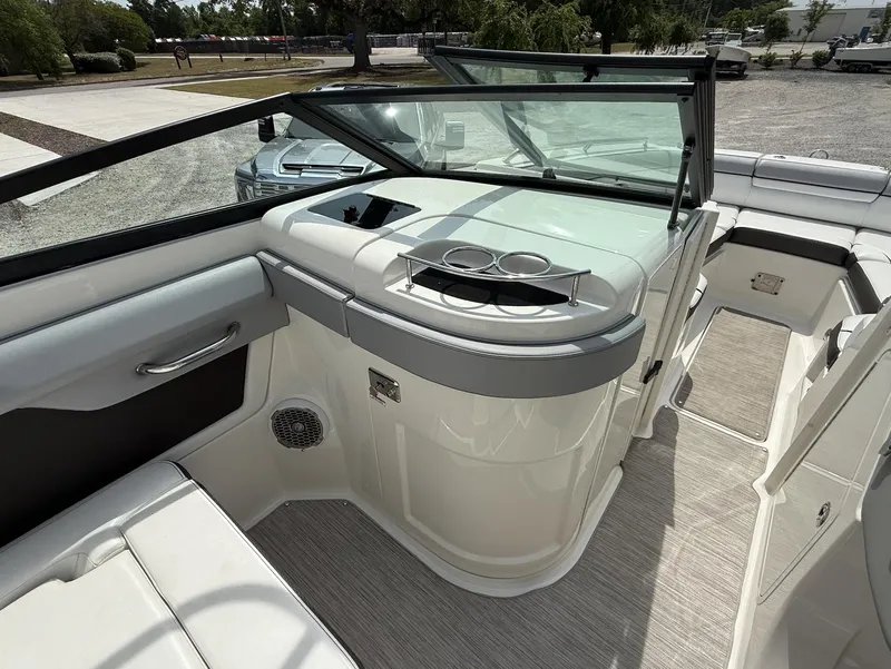 Slide: The Image of 2017 Sea Ray SDX 270 Outboard interior with seating and cup holders. - 8