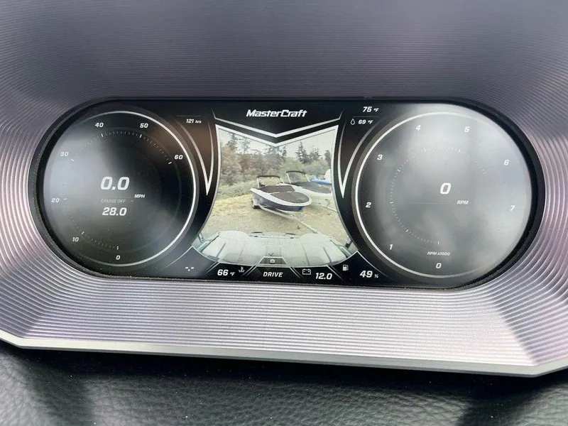 Slide: The Image of Dashboard of a 2019 MasterCraft X22 boat displaying speed, RPM, and rearview camera. - 10