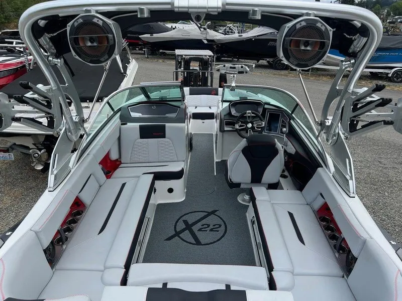 Slide: The Image of 2019 MasterCraft X22 boat interior with sleek seating and advanced dashboard features. - 5
