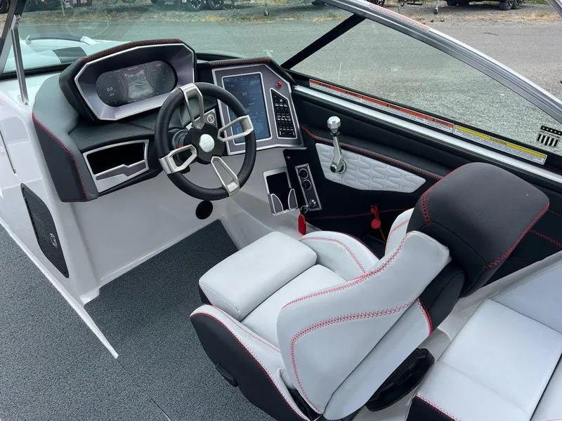Slide: The Image of 2019 MasterCraft X22 boat interior with modern dashboard and steering wheel. - 6