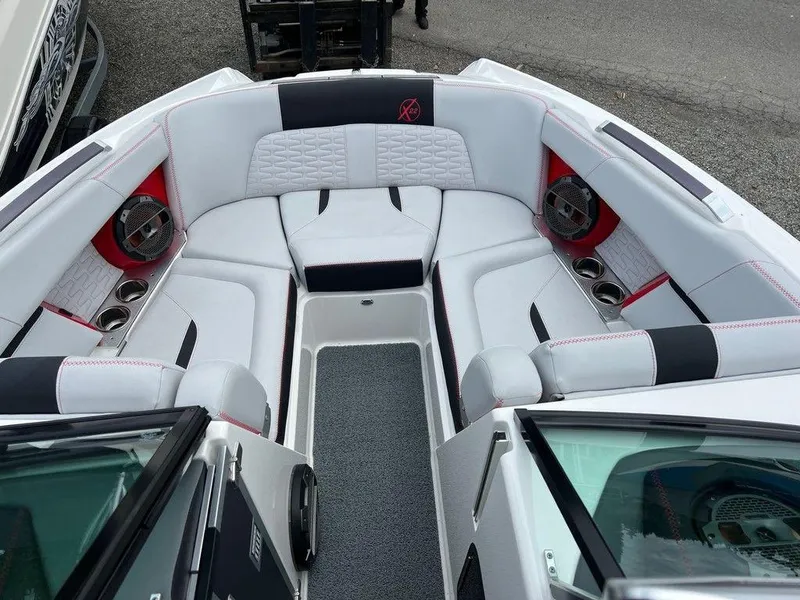 Slide: The Image of Luxurious interior of a 2019 MasterCraft X22 boat with white and black seating. - 7