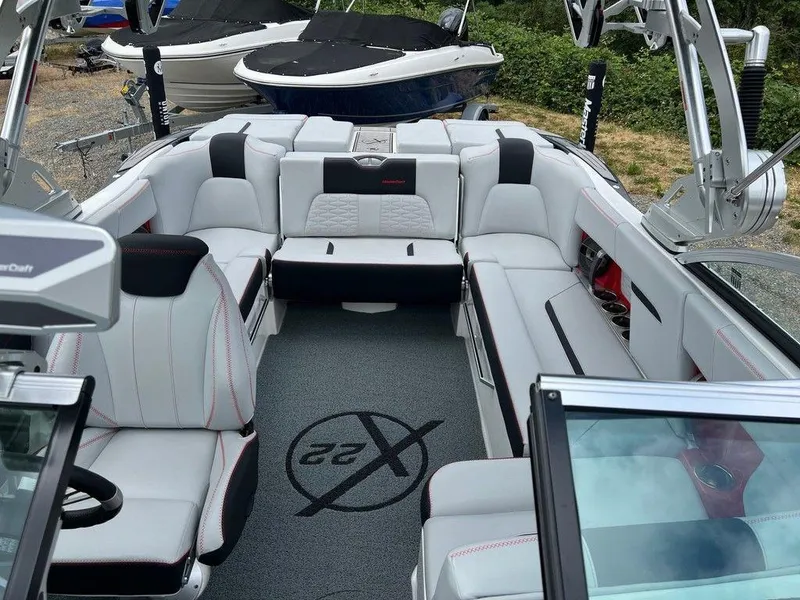 Slide: The Image of 2019 MasterCraft X22 boat interior with luxurious seating and modern design. - 9