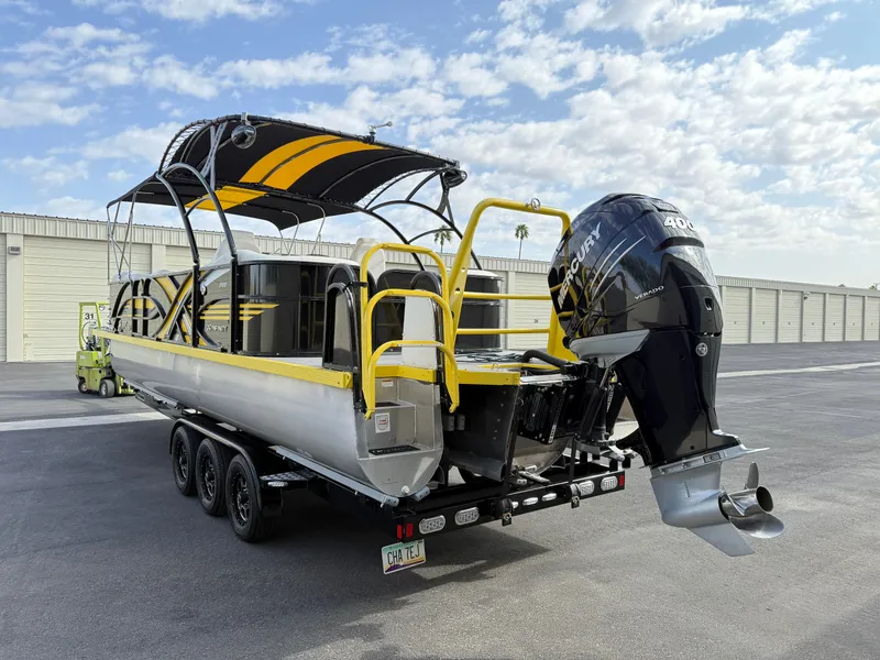 Slide: The Image of PlayCraft Infinity 2900 pontoon boat, 2021 model, with a powerful outboard motor on a trailer. - 11