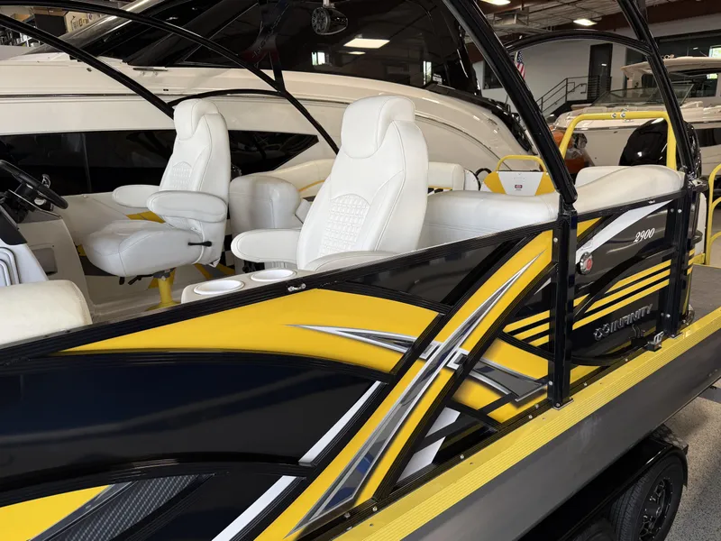 Slide: The Image of 2021 PlayCraft Infinity 2900 boat with sleek yellow and black design, luxurious white seating. - 22