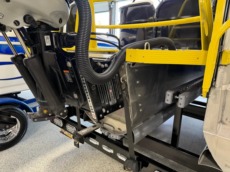 Slide: The Image of 2021 PlayCraft Infinity 2900 boat engine and components in a garage setting. - 25