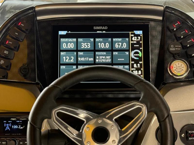 Slide: The Image of Dashboard of 2021 PlayCraft Infinity 2900 boat with Simrad navigation display. - 34