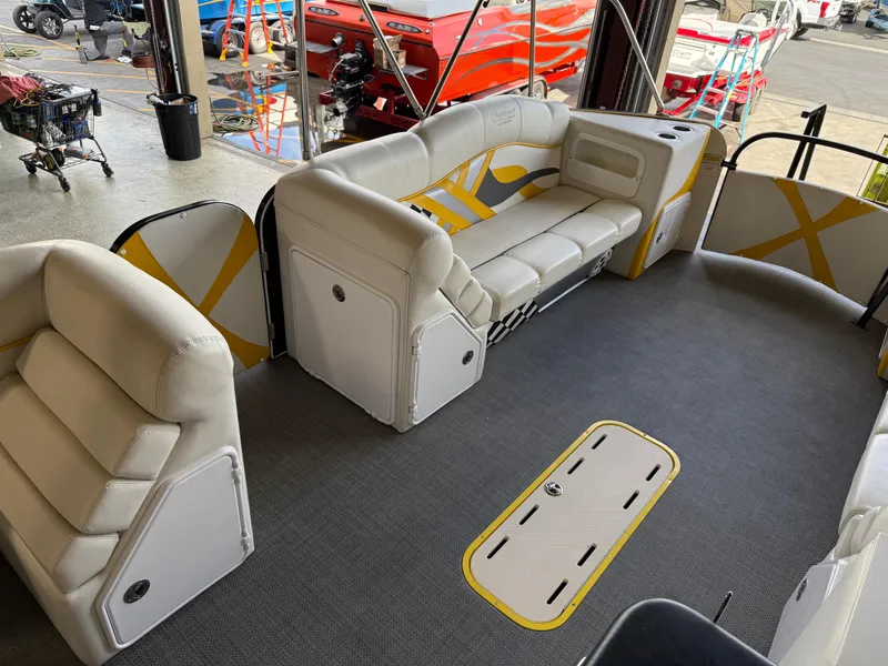 Slide: The Image of Interior of 2021 PlayCraft Infinity 2900 pontoon boat with white seating and modern design. - 37