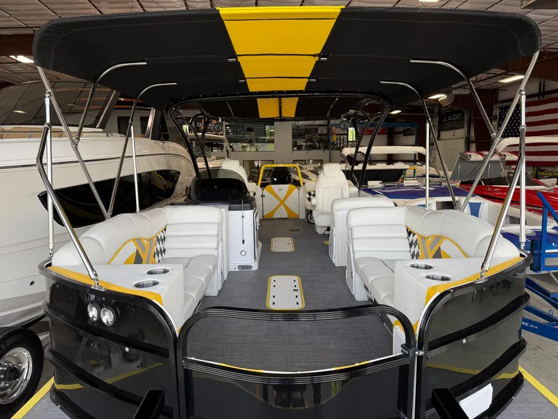 Slide: The Image of 2021 PlayCraft Infinity 2900 pontoon boat with spacious seating and sleek black and yellow design. - 41