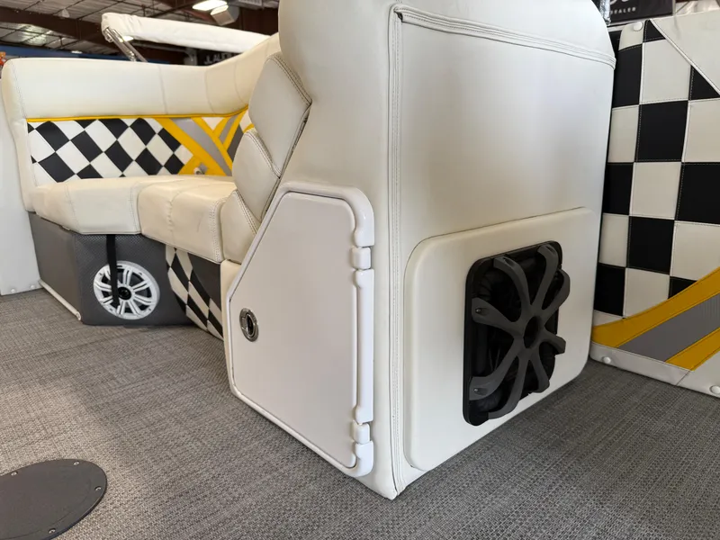 Slide: The Image of 2021 PlayCraft Infinity 2900 interior with white seating, checkered design, and speaker system. - 49