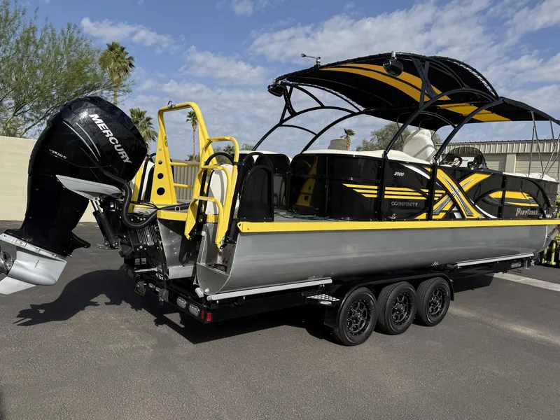 Slide: The Image of 2021 PlayCraft Infinity 2900 boat with Mercury engine on a trailer, featuring yellow and black design. - 8