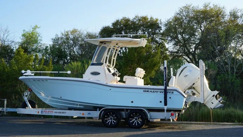 Slide: The Image of 2024 Grady-White 231 Coastal Explorer boat on trailer, parked outdoors. - 16