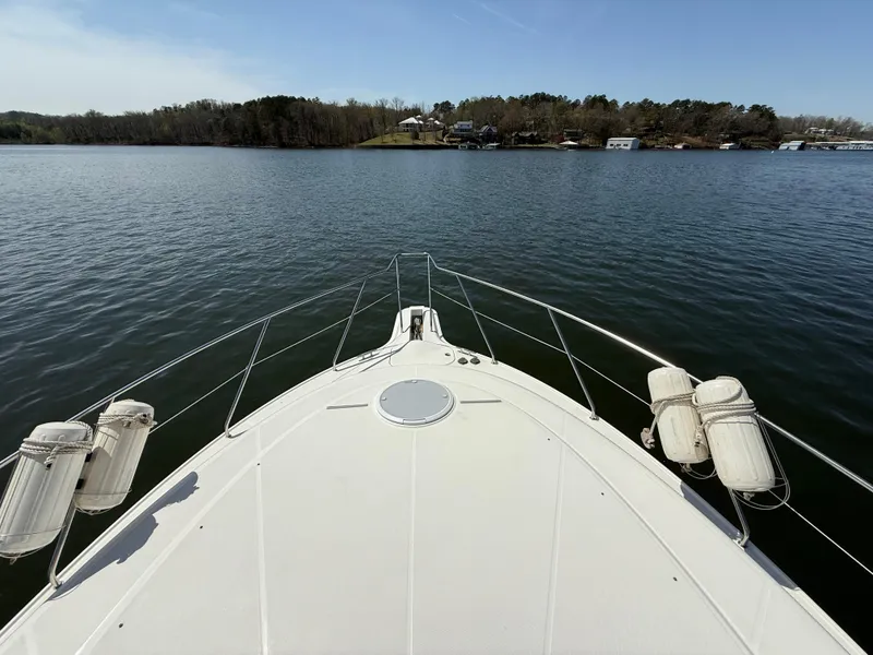 Slide: The Image of Bow view of 2007 Silverton 36 Convertible yacht on a calm lake. - 13