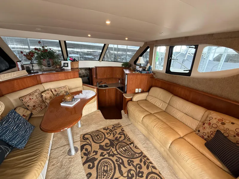 Slide: The Image of Luxurious interior of 2007 Silverton 36 Convertible yacht with plush seating and elegant decor. - 25