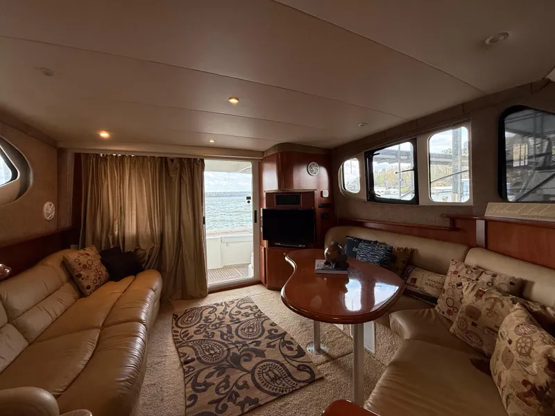 Slide: The Image of Interior of 2007 Silverton 36 Convertible yacht with cozy seating and ocean view. - 26