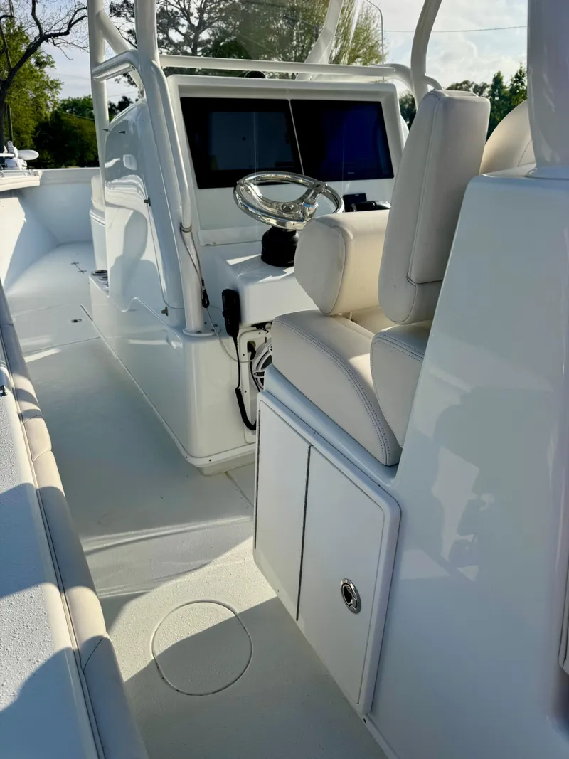Slide: The Image of 2022 Yellowfin 36 Open boat interior with modern helm and seating. - 11