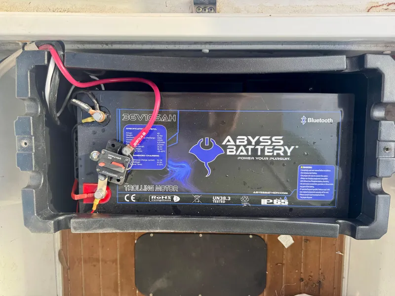 Slide: The Image of Battery compartment of a 2022 Yellowfin 36 Open with Abyss Battery installed. - 16