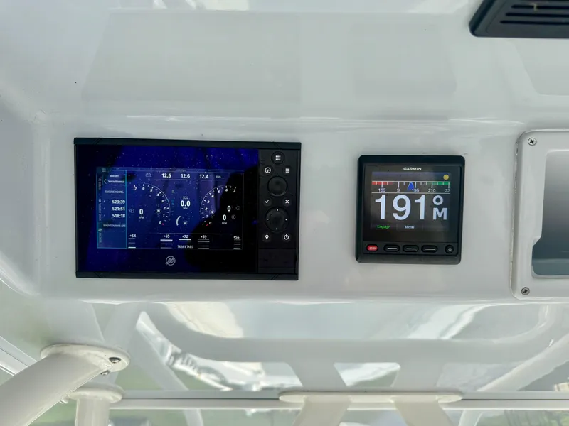 Slide: The Image of Control panel of 2022 Yellowfin 36 Open boat with digital displays. - 21