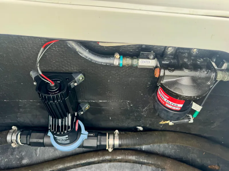Slide: The Image of Electrical and plumbing components inside a 2022 Yellowfin 36 Open boat. - 23