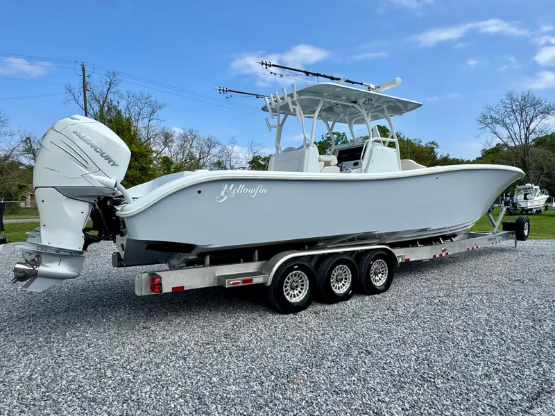 Slide: The Image of 2022 Yellowfin 36 Open boat on a trailer, featuring twin outboard engines. - 3