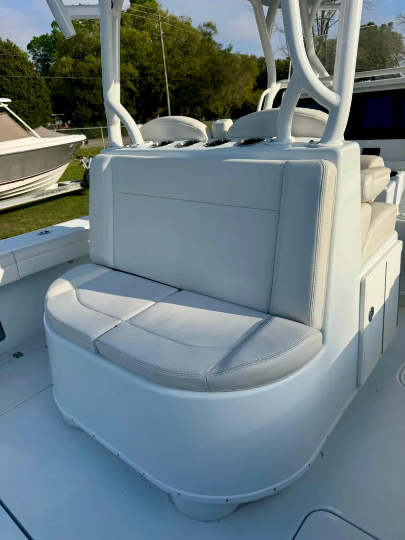 Slide: The Image of 2022 Yellowfin 36 Open boat with cushioned seating and sleek design. - 9