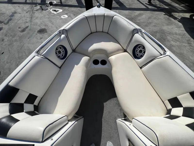 Slide: The Image of Interior of 2002 MB B52 boat with white seating and built-in speakers. - 20