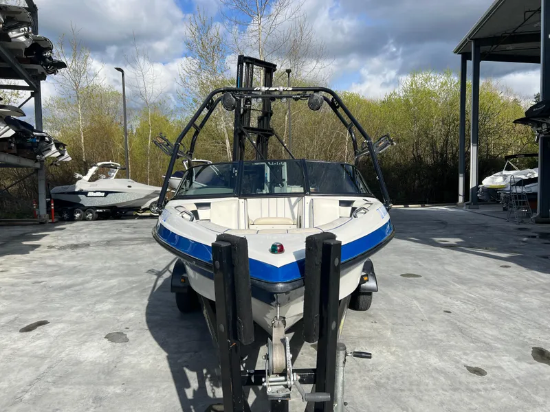 Slide: The Image of 2002 MB B52 boat on trailer in outdoor storage facility. - 3