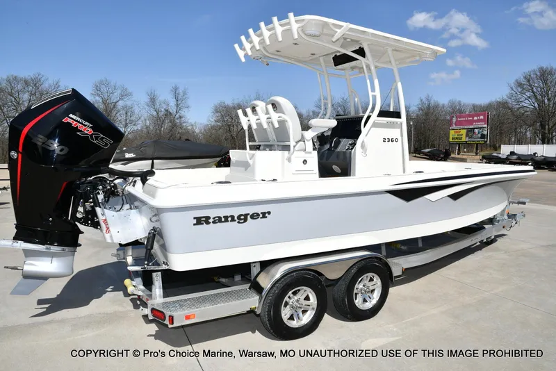 Slide: The Image of 2023 Ranger 2360 Bay boat on trailer, featuring Mercury Pro XS engine. - 12
